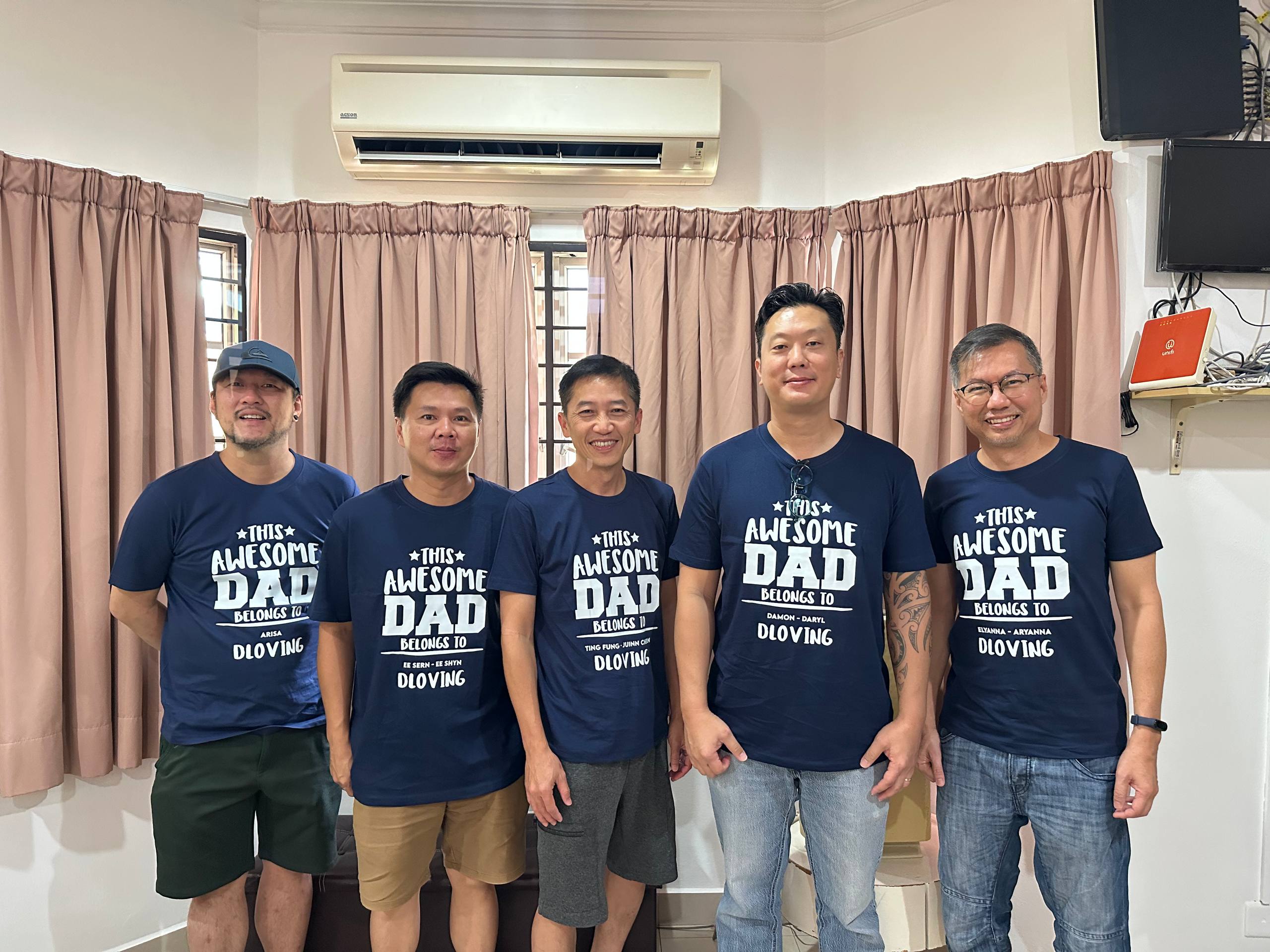 Dloving fathers wearing Super Daddy shirts together
